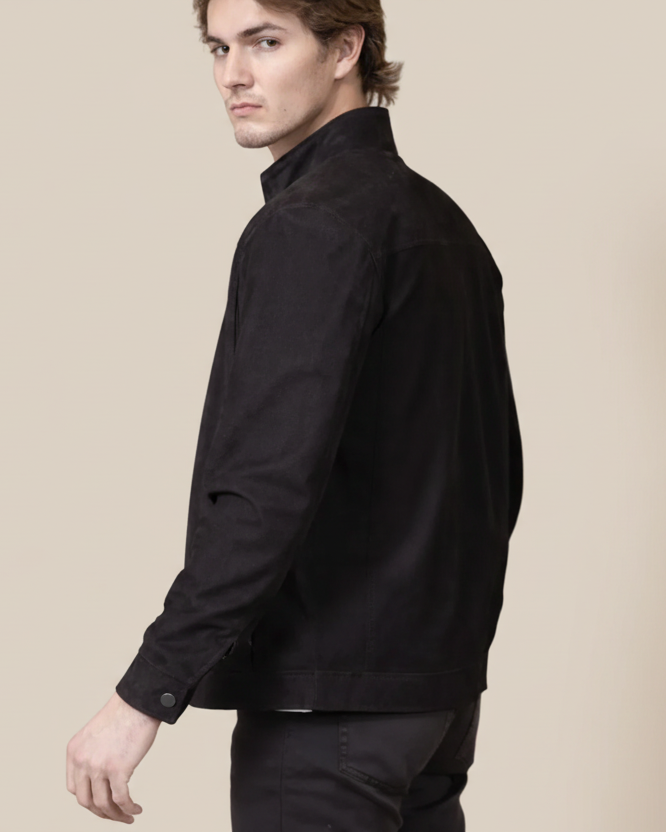 Man wearing a black jacket on a white background