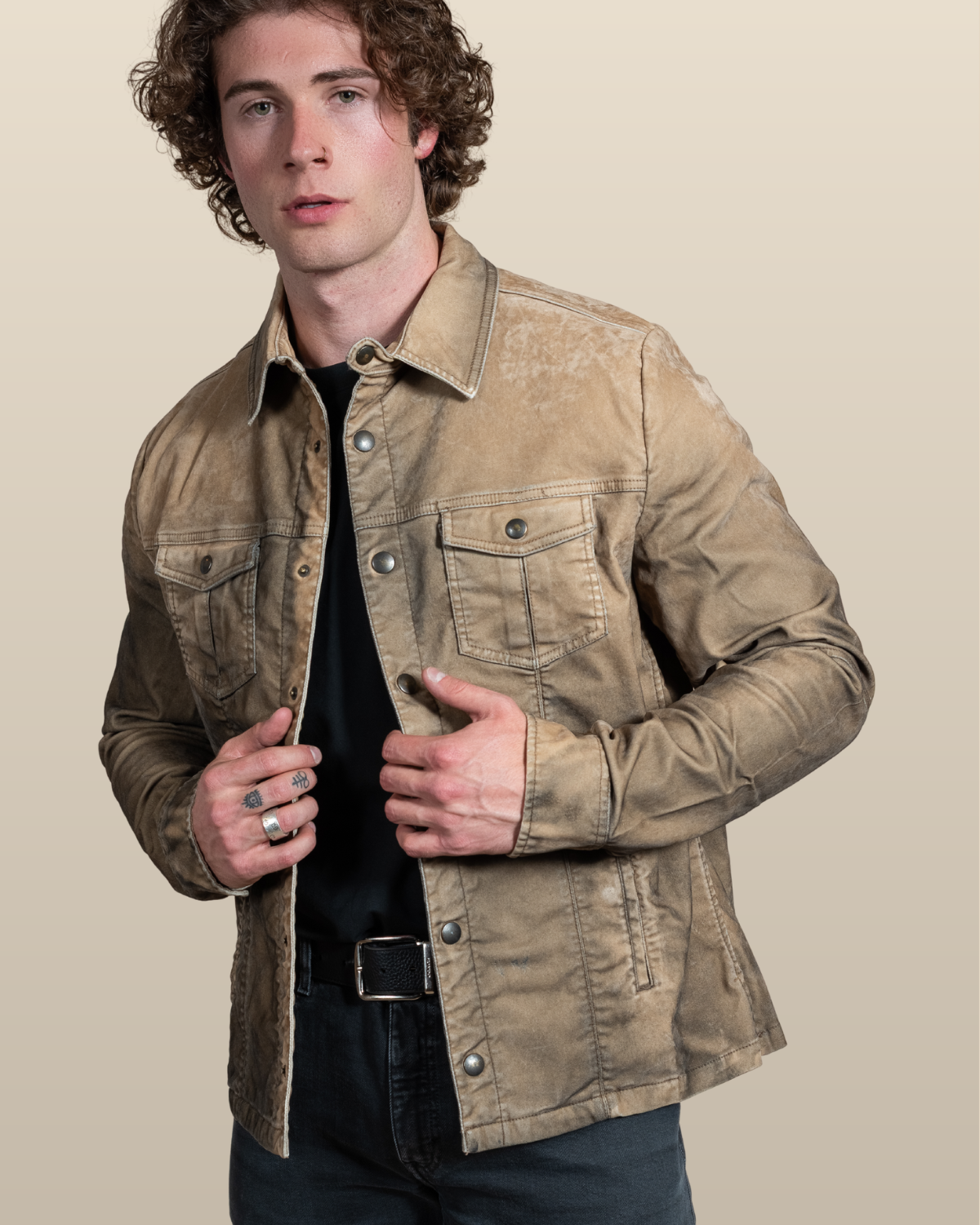 HYDE Sawyer moleskin trucker jacket in desert, front view worn open over a black tee — overdyed, sandblasted finish with a soft suede-like hand and brushed brass buttons