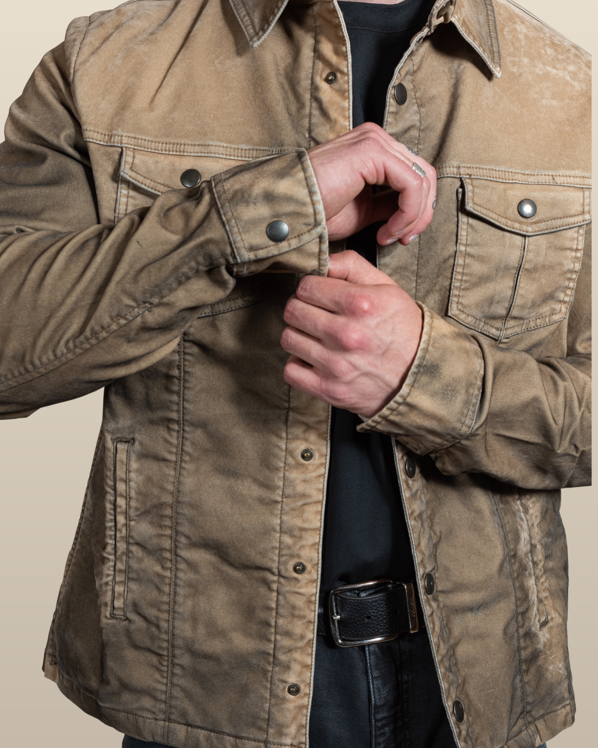 Detail of the HYDE Sawyer desert moleskin trucker jacket — brushed brass snap cuff and flap chest pocket on suede-like overdyed moleskin