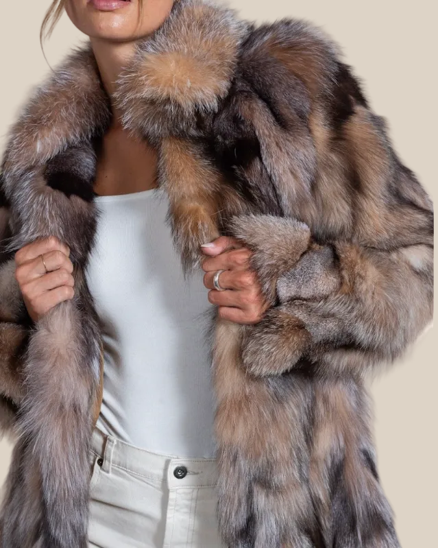 Person wearing a fur coat with a neutral background