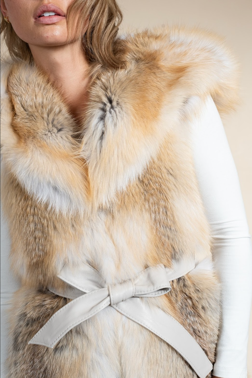 Close-up of a fur vest with a neutral background