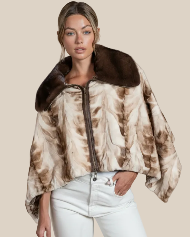 Woman wearing a patterned jacket with a fur collar on a beige background