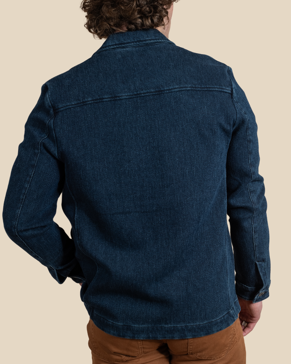 Detail of the HYDE Tennessee blue chore jacket — cotton-blend twill with flap chest pocket and engraved Teleria Zed shank button