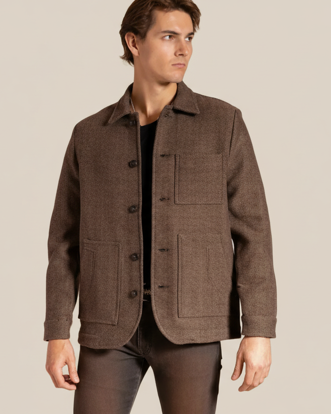 Man wearing a brown jacket on a beige background