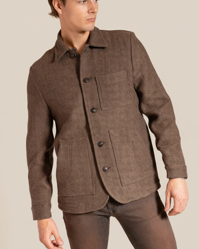 Brown jacket worn by a person on a beige background