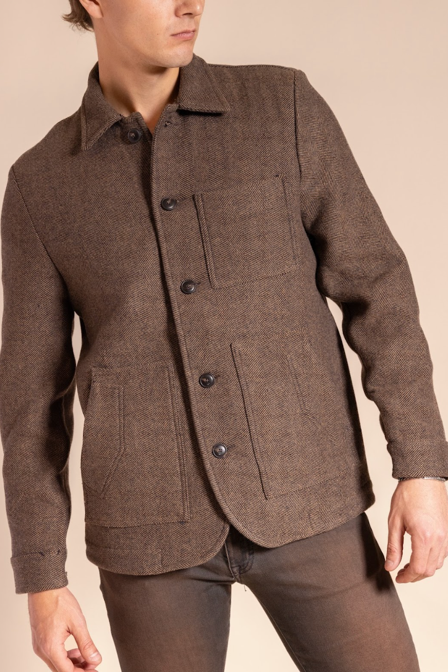Brown jacket worn by a person on a beige background