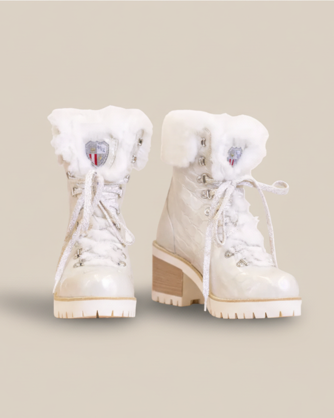 White winter boots with fur lining on a white background